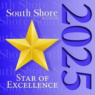 A large gold star on a blue background with the words South Shore Magazine Star of Excellence and 2023 in bold letters, celebrating outstanding memory care Massachusetts or Norwell nursing home services.