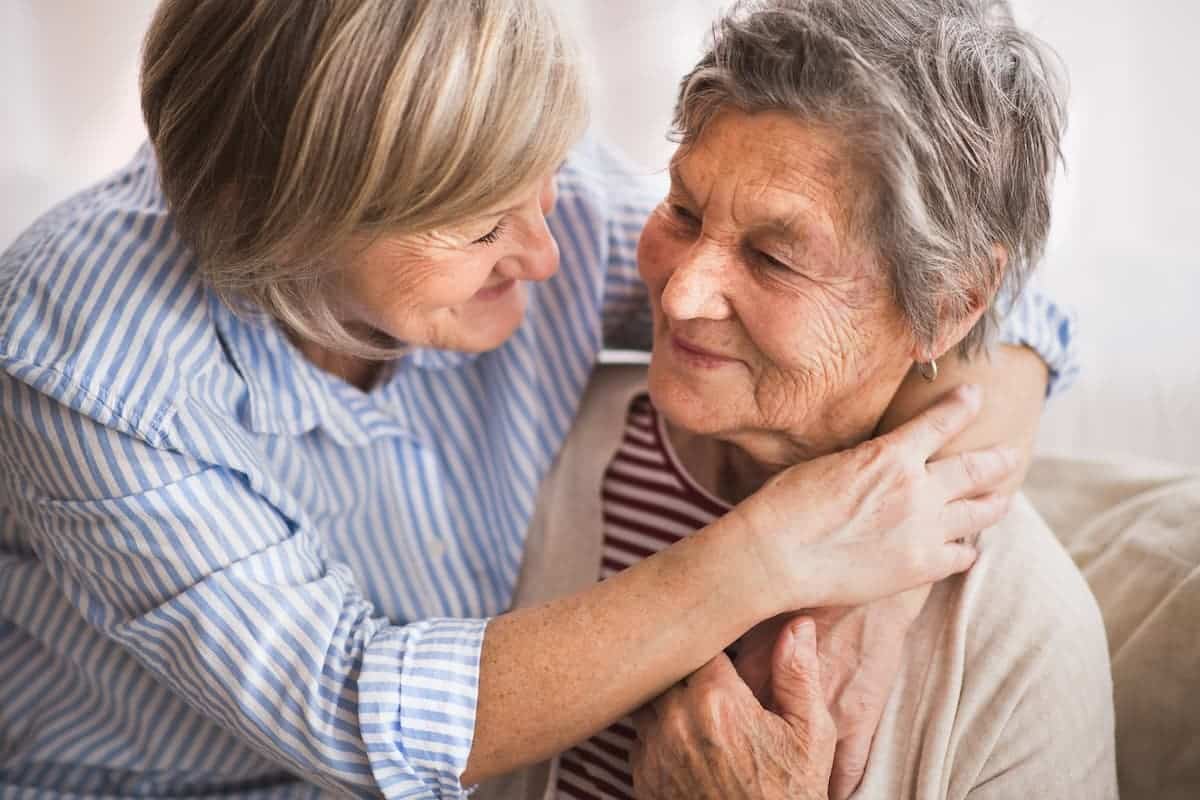 The Cordwainer Memory Care | Daughter and senior mother hugging